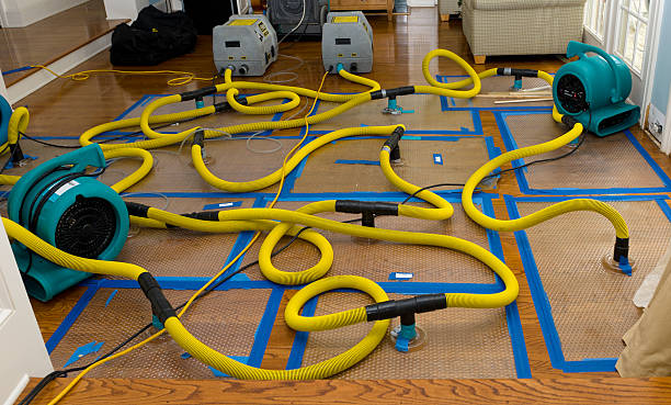 Professional Flood Damage Restoration technician working in Berea, OH